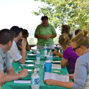 A woman leads a staff meeting.