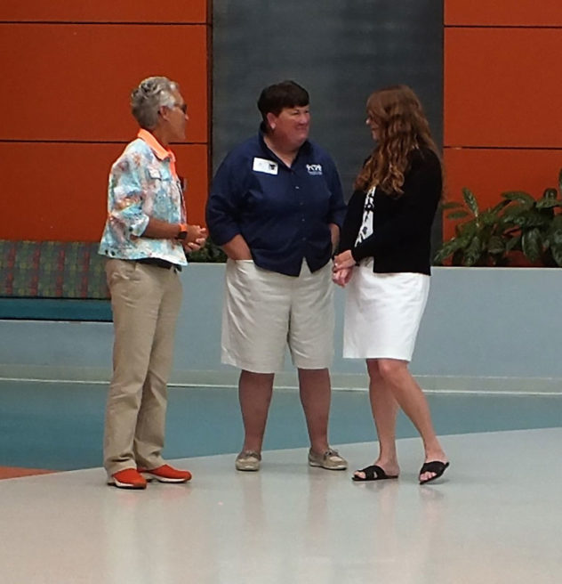 Three two women talking together.