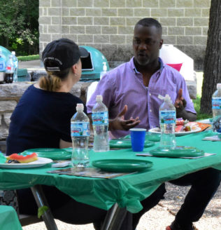 Two staff members meeting together.