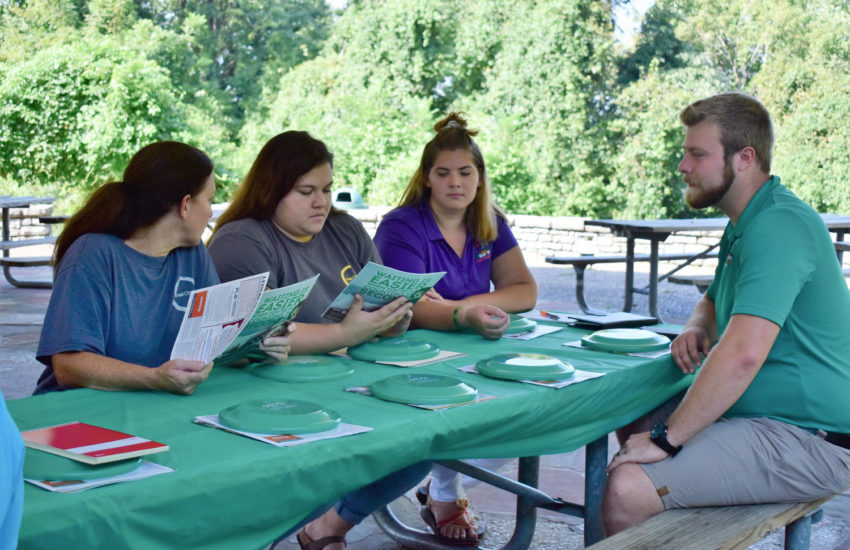 Recreation Council staff talking at a meeting.