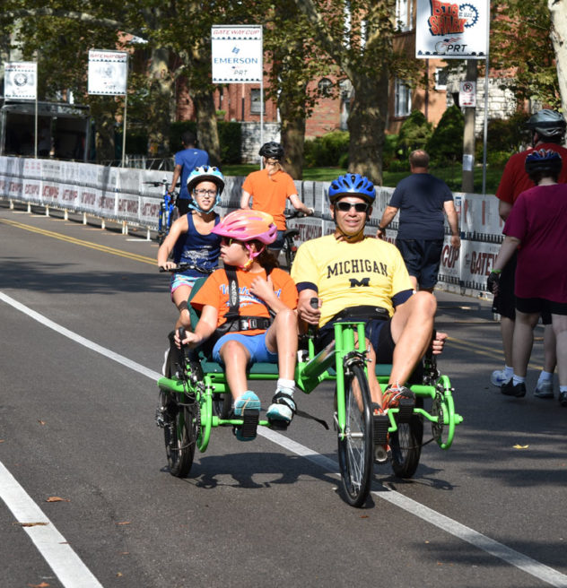 Father and child biking.